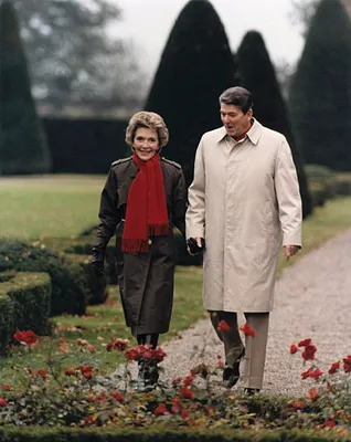Photograph of President Ronald Reagan and Mrs. Nancy Reagan Walking Together at the Pometta Residence in Geneva, Switzerland