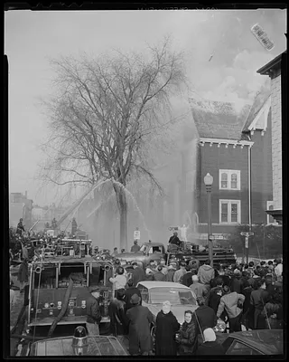 Fire truck hose pointed at Sacred Heart Church on Brooks St.