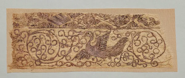 Embroidered fragment with bird among vines