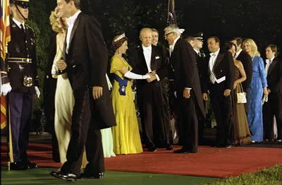 President Gerald R. Ford and Queen Elizabeth II of Great Britain Greeting Actor Cary Grant in the Receiving Line on the South Driveway of the White House Prior to a State Dinner Honoring Her Majesty and Prince Philip