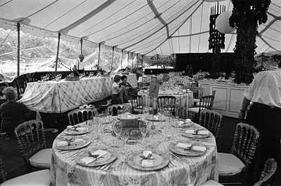 White House Support Staff Setting Tables and Arranging Decorations in the Tent in the White House Rose Garden during Preparations for a State Dinner Honoring Prime Minister Malcolm Fraser of Australia