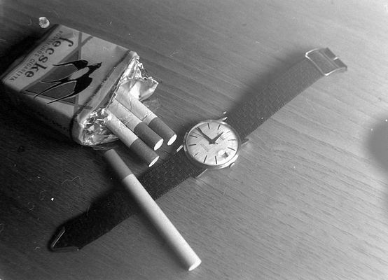 Wristwatch and Cigarette Pack Still Life