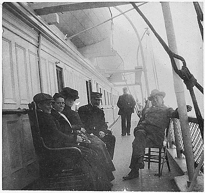 Three men, three women on ship's deck. Man on the far right is identified as Judge Mayer.