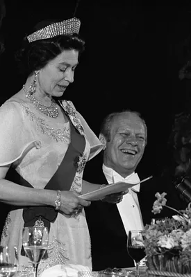 President Gerald R. Ford Laughing as Queen Elizabeth II of Great Britain Delivers Remarks at a State Dinner Honoring Her Majesty and Prince Philip