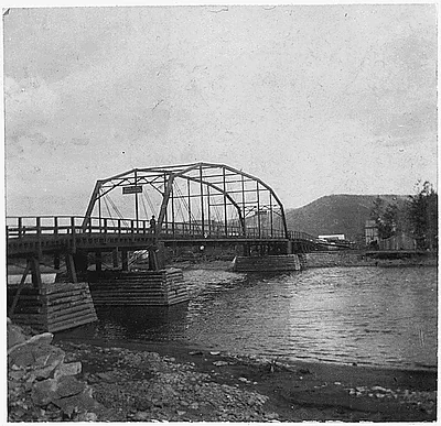 Bridge with sign: "Walk your horses."