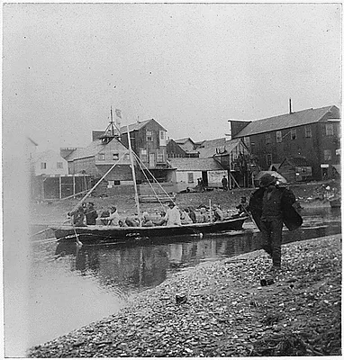Indians arriving on sandspit at Nome from Port Clarence.