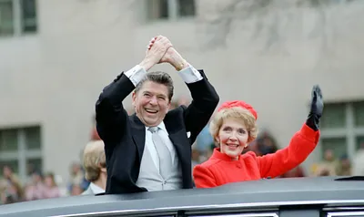 President Ronald Reagan and Nancy Reagan waving from the limousine during the Inaugural Parade in Washington DC