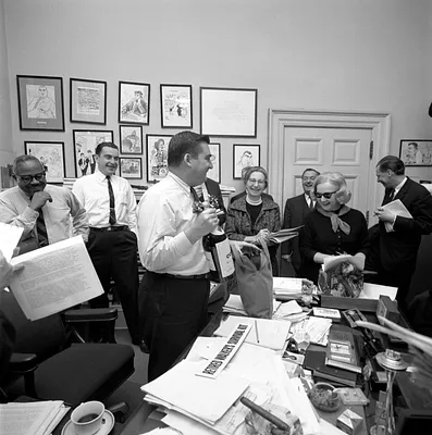 Press Secretary Pierre Salinger Receives a Retired Walker's Survival Kit from His Colleagues